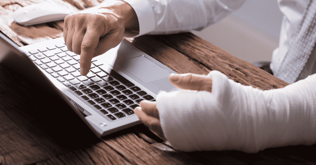My Doctor Released Me Back To Full Duty, But I Am Still Injured. What Do I Do? 1 Working on laptop with injured hand