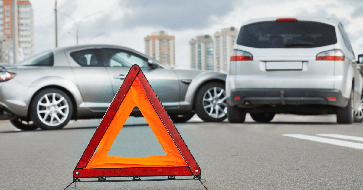 Can I Appeal And Overturn A Denied Car Wreck Insurance Claim In Virginia? 1 Road triangle warning sign in front of car accident scene